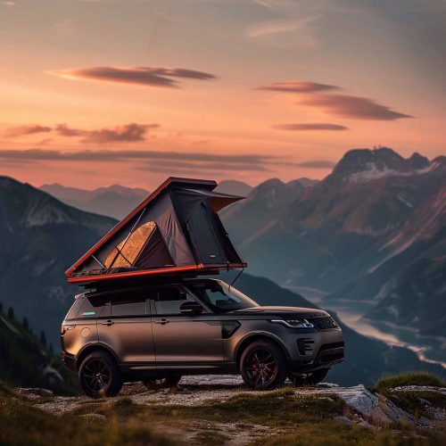 Rooftop tent on high mountain top at sunset