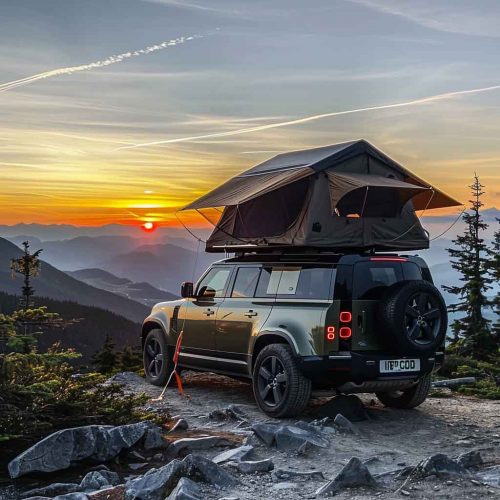 On the top of the mountain, the sunset reflects, and the roof tent becomes a camping home