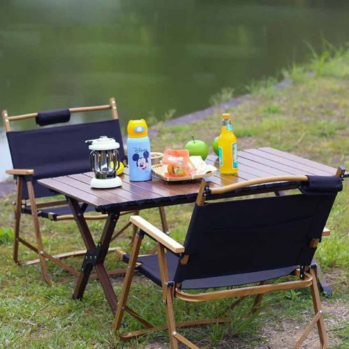 Folding tables and chairs by the lake